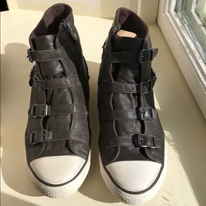 Brown leather hi tops with side zip and 4 straps.